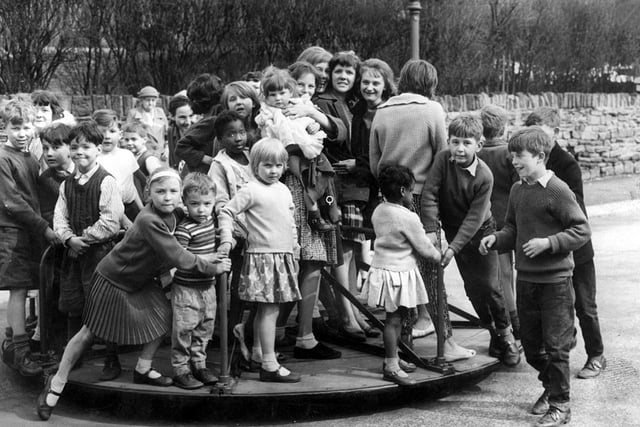 How many kids can you get on a roundabout?  Children at Countess Road, playground, Sheffield (1962)
Picture: Sheffield Newspapers
