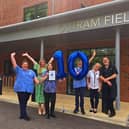 Staff at Outram Fields celebrating the care home's 10 out of 10 review score