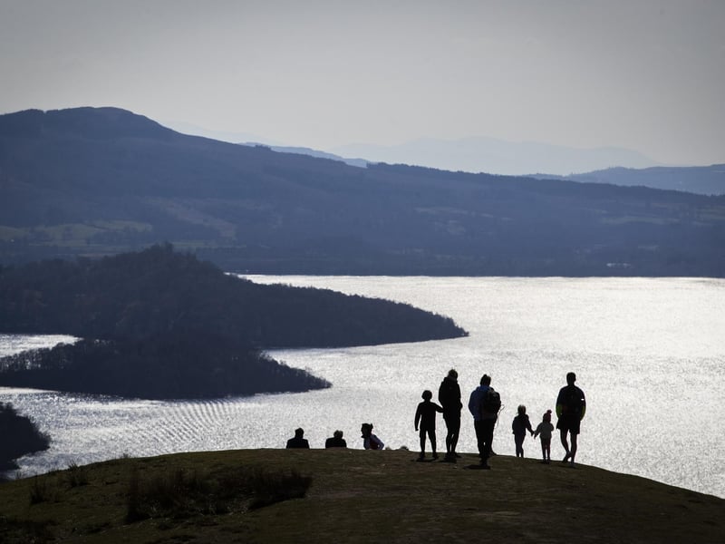 Another one of Scotland's routes - Loch Lomond to Lochgilphead - made it into the study's top ten places to road trip around in the UK. The picture shows a family looking out across Loch Lomond from Conic Hill, near Balmaha.