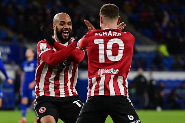 David McGoldrick of Sheffield United celebrates scoring at Cardiff City with skipper Billy Sharp: Ashley Crowden / Sportimage