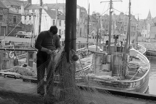 Fraserborough - Fisherman mending nets.