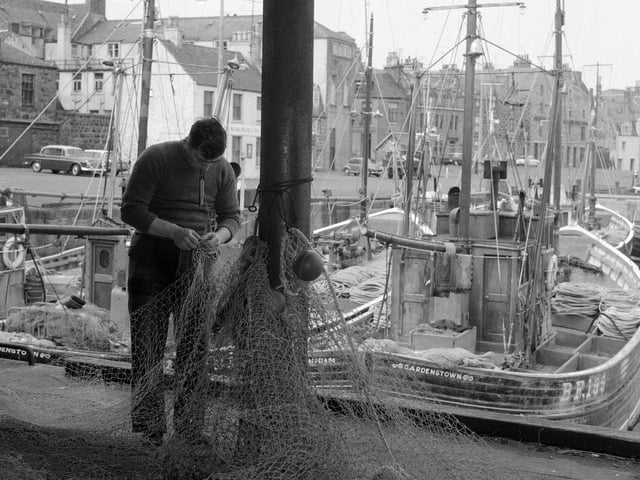 Fraserborough - Fisherman mending nets.