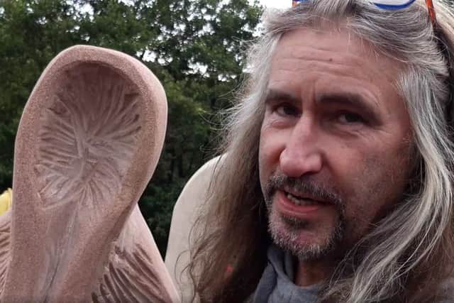 Sculptor Andrew Vickers with the figure at the centre of Storrs Henge in Stannington