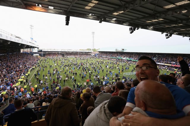 A view from the Fratton End as fans invade the pitch at the final whistle.