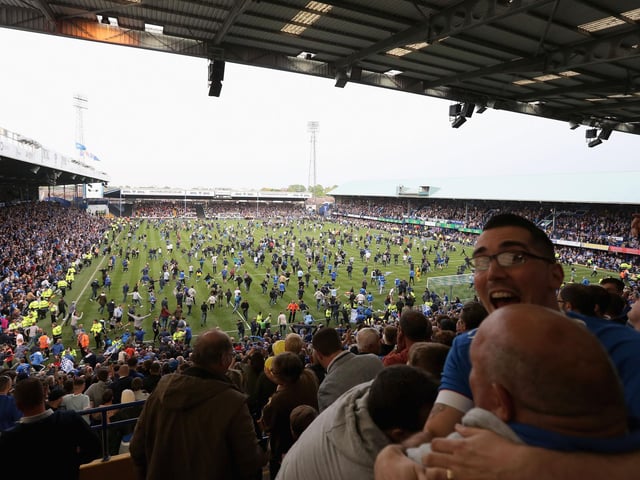 A view from the Fratton End as fans invade the pitch at the final whistle.