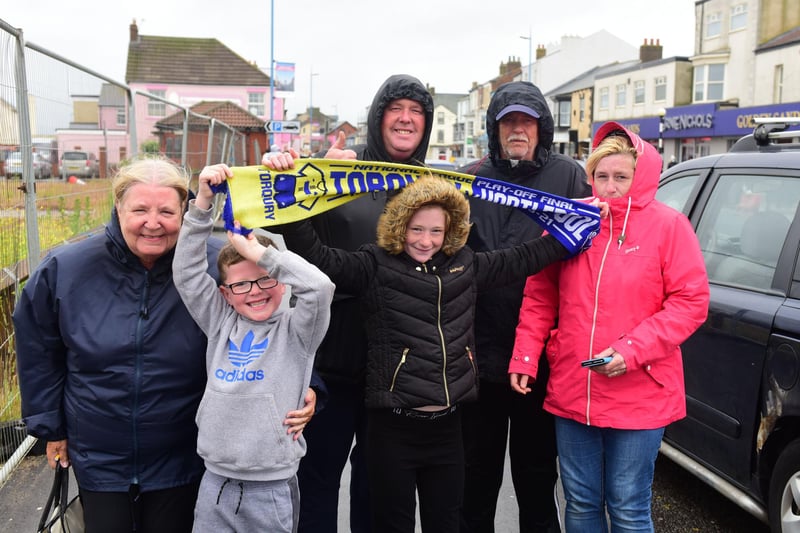Fans wait for the Hartlepool United parade in Seaton Carew.