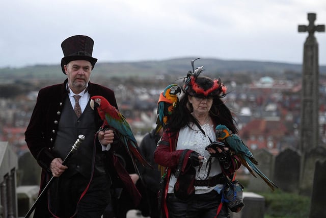 Participants in costume attend the biannual 'Whitby Goth Weekend' festival at St Mary the Virgin's Church in Whitby, northern England, on October 31, 2021. - The festival brings together thousands of goths and alternative lifestyle fans from the UK and around the world for a weekend of music, dancing and shopping. (Photo by Oli SCARFF / AFP) (Photo by OLI SCARFF/AFP via Getty Images)