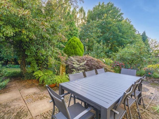 Another view of the seating area in the back garden. It shows the delightful surroundings.