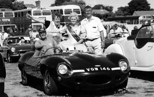 1958 d-type Jaguar replica owner Eric Ansell with Gosporteers rally chairman Pat Doran and carnival queen Clair Lee at Stokes Bay for the Gosport Carnival in 1995. The News PP5609