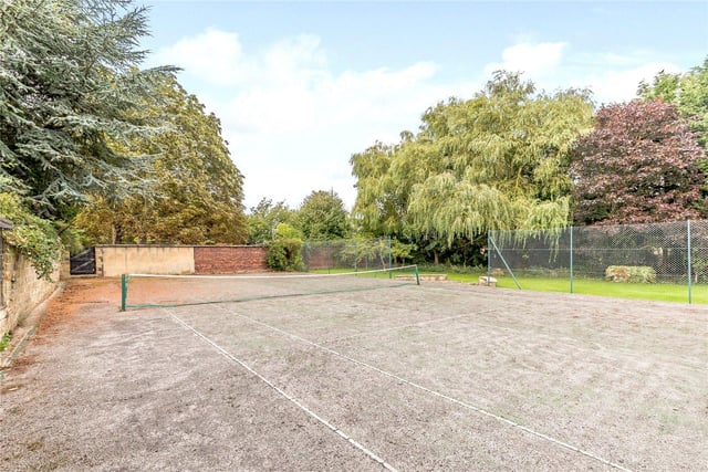 Several further out houses are included in the grounds, as well as this full sized functional tennis court.