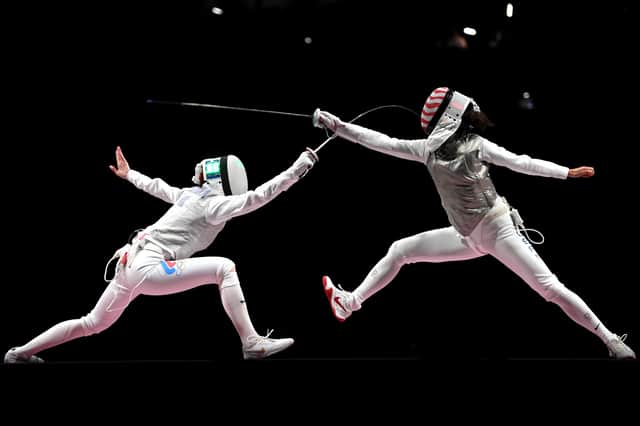 Inna Deriglazova of Team ROC (L) competes against Lee Kiefer of Team United States (R) in the Women's Foil Individual Fencing Gold Medal Bout on day two of the Tokyo 2020