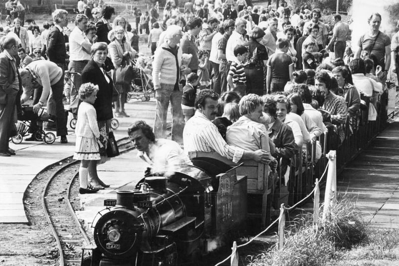 Bank Holiday crowds at the South Marine Park watch as a steam engine takes another load of passengers for a trip around the lake. Does this bring back memories from the early 1980s?