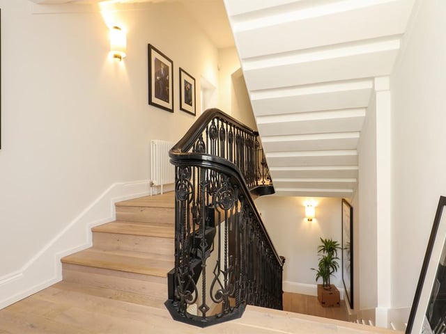 The property still has the original sweeping staircase and hardwood floors.