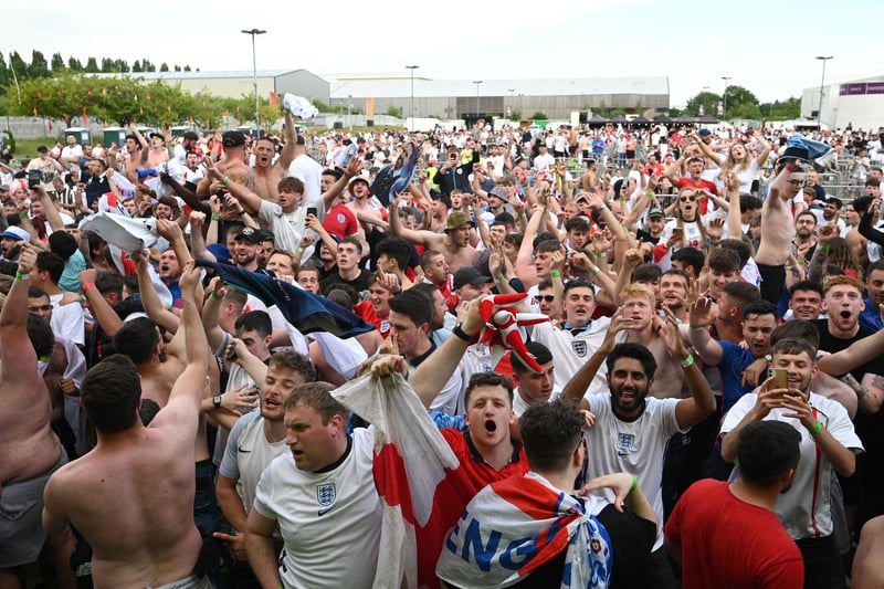 England supporters react to England's second goal in Manchester (AFP via Getty Images)