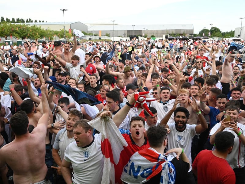 England supporters react to England's second goal in Manchester (AFP via Getty Images)