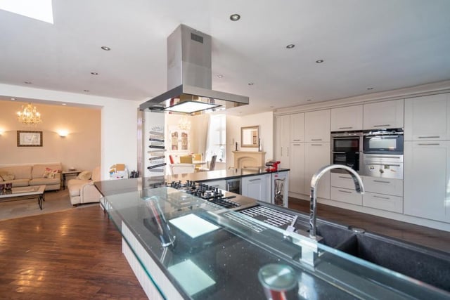 The kitchen is fitted with a range of appliances and boasts two Siemen warming drawers, an integrated dishwasher, breakfast bar,  and an integrated wine cooler.

Photo: Rightmove/Michael Hodgson