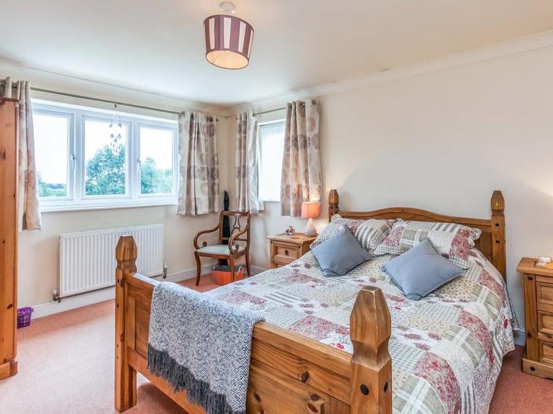 The master bedroom is bright and oozing comfort, with double-glazed windows, a central heating radiator and coving to the ceiling. Its en-suite is fitted with a shower, wash hand basin and low-level WC.