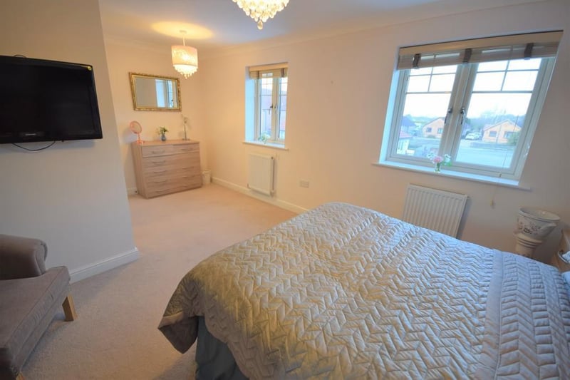 A beautiful double bedroom which was originally two separate bedrooms that could be easily converted back if needed. With two radiators, useful storage cupboard, wall mounted TV connection point and two double glazed windows to the front elevation.