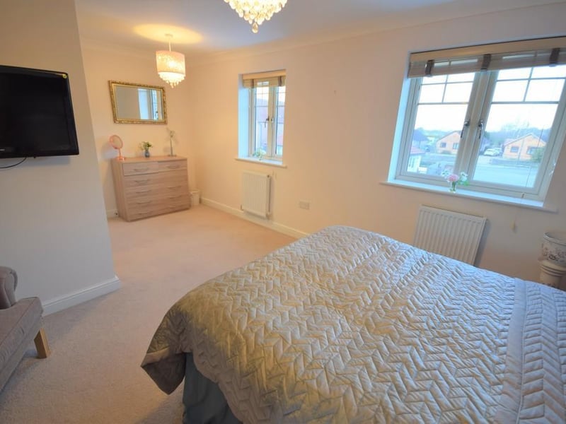 A beautiful double bedroom which was originally two separate bedrooms that could be easily converted back if needed. With two radiators, useful storage cupboard, wall mounted TV connection point and two double glazed windows to the front elevation.