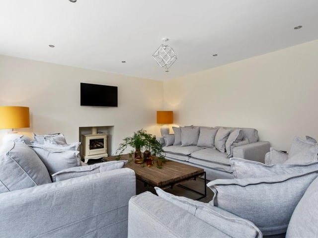 Another shot of the living room. It's not hard to imagine an evening of cosy luxury, cuddled up in front of the fire or the TV.