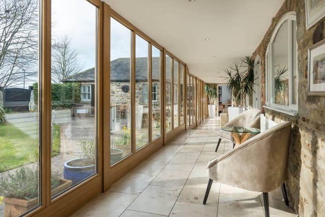 Bradley Hall says: "A stunning feature of the property is the oak and glass single storey link within the courtyard which provides access to each individual room."