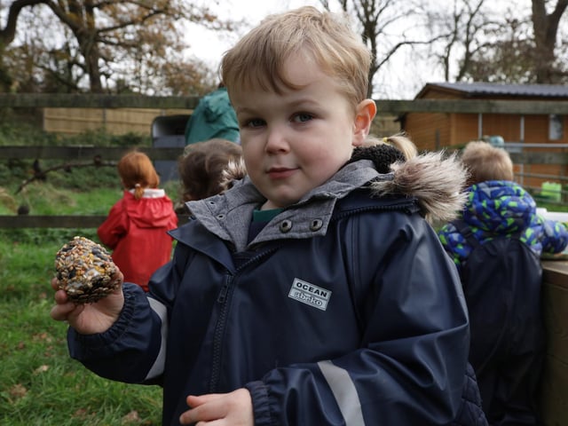 Ethan Blackmore, age three, with some food for the birds
