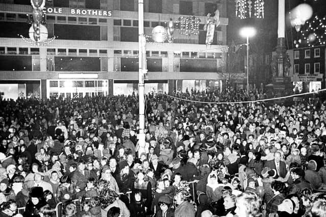 The crowds gather outside Cole Brothers department store in Barkers Pool, Sheffield, for the switch on of the Christmas lights in 1974