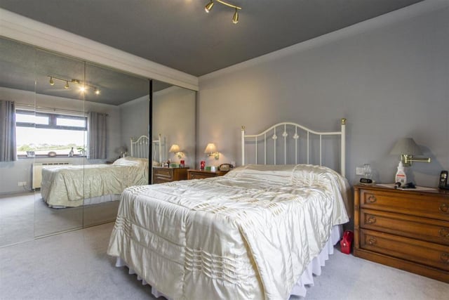 The  master bedroom is a good-sized double with built-in wardrobes that have sliding mirror doors.
