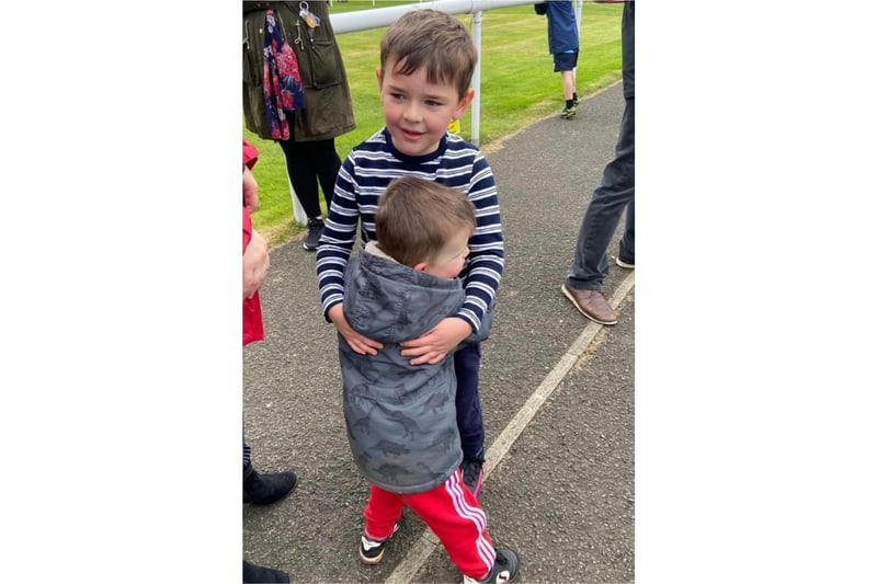 Lesley Gilbert took this picture of "cousins, finally able to hug".