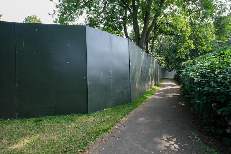 A huge wall is constructed around the park ahead of the music festival this Friday.