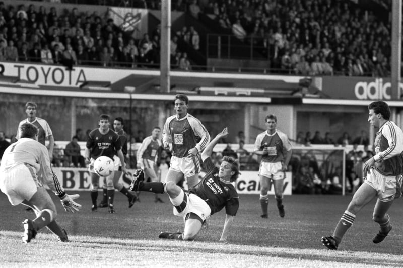 Hibs' goalkeeper Andy Goram gets ready bu Hearts' Scott Crabbe fails to get the ball home during a Hibs v Hearts Edinburgh derby football match at Easter Road in November 1989. Final score 1-1 draw.
