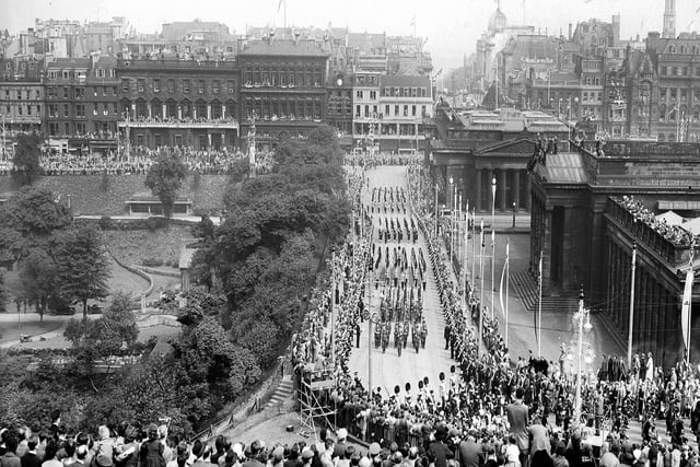 The Royal Procession for the Queen's Coronation visit to Edinburgh travels up the Mound in June 1953.