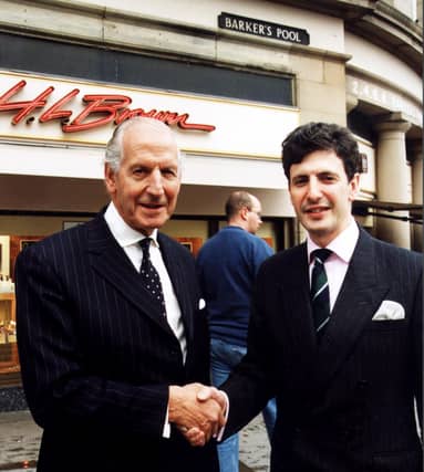 Michael Frampton relinquishes the reins to his son Jimmy at H. L. Brown Jewellers, Barker's Pool, Sheffield, on October 29. 2001