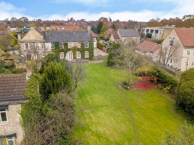 The house has a large south-facing garden with mature trees and shrubs to its borders.