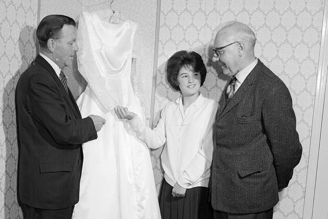 Queen Margaret Donaldson shows off her dress