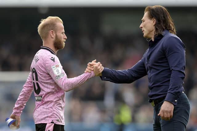 Wycombe Manager Gareth Ainsworth with Owls skipper Barry Bannan at the final whistle.   Pic Steve Ellis
