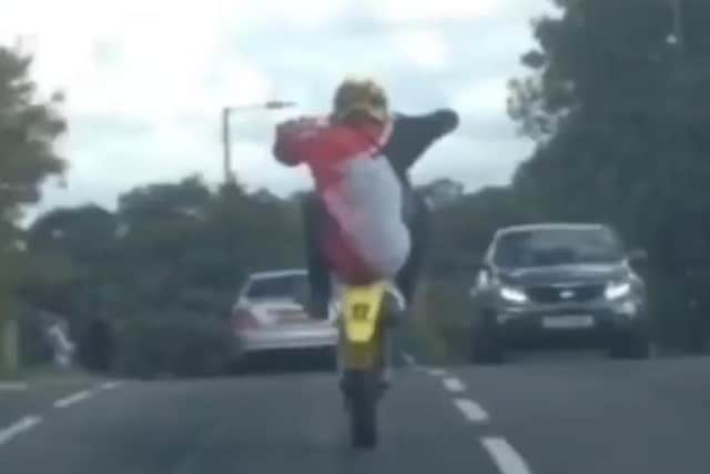 A motorcyclist attempts a wheelie on Stradbroke Road in Sheffield.... but it's about to go terribly wrong (still from video shared by Procter Caulay)