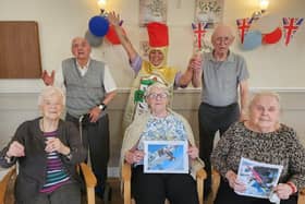 Activities coordinator Rachael Addy (back, centre) and residents at Deangate Care Home, in Barnsley.