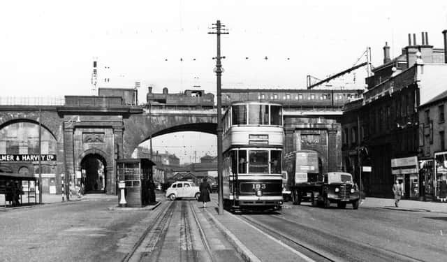 An old view of the Wicker with a train travelling along the Wicker Arches after leaving Sheffield Victoria Station