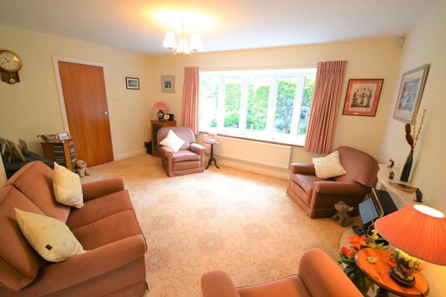 Lounge - A good sized living room with open plan access to the dining room, having a pleasant view of the front garden from a UPVC double glazed bow window, feature coal effect electric fire with marble surround, various power sockets, tv aerial point and a large central heating radiator.