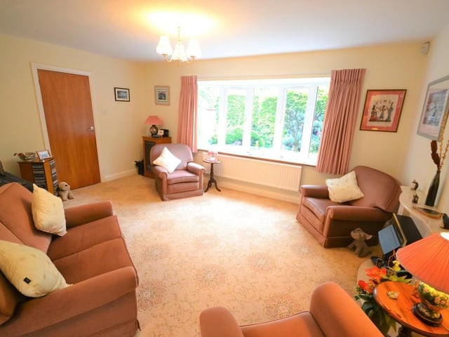 Lounge - A good sized living room with open plan access to the dining room, having a pleasant view of the front garden from a UPVC double glazed bow window, feature coal effect electric fire with marble surround, various power sockets, tv aerial point and a large central heating radiator.