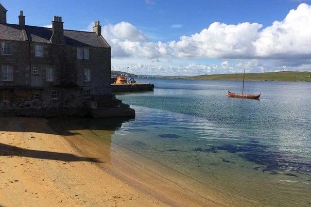 This renovated 1760 two-storey townhouse is located in the picturesque Lerwick and has lovely beach views.
