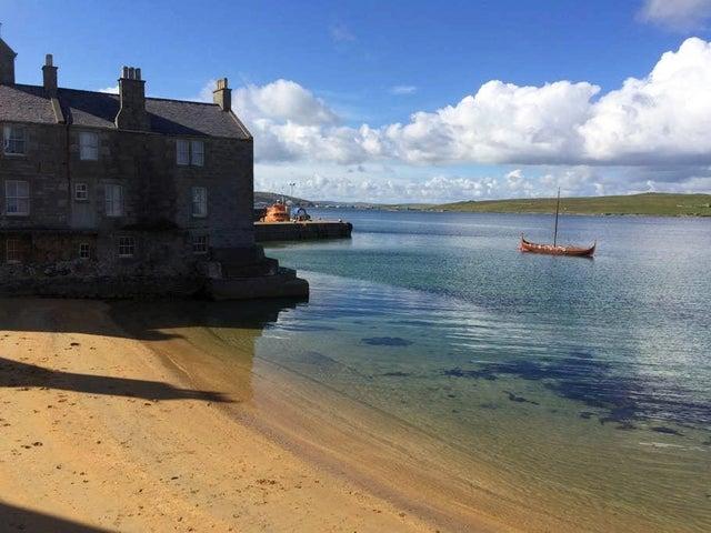 This renovated 1760 two-storey townhouse is located in the picturesque Lerwick and has lovely beach views.