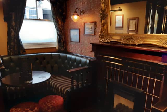 A cozy corner of the Three Tuns, which has been operating as a pub since the 1700s