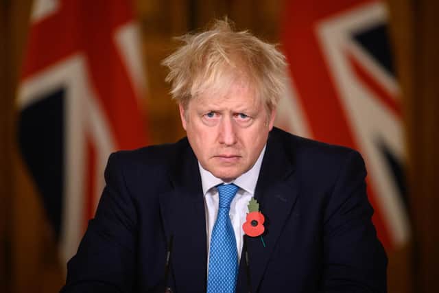 UK Prime Minister Boris Johnson answers questions during a briefing on the current coronavirus pandemic (Photo by Leon Neal - WPA Pool/Getty Images)