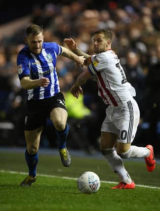 Tom Lees of Sheffield Wednesday battles with Billy Sharp of Sheffield United. (Photo by Stu Forster/Getty Images)