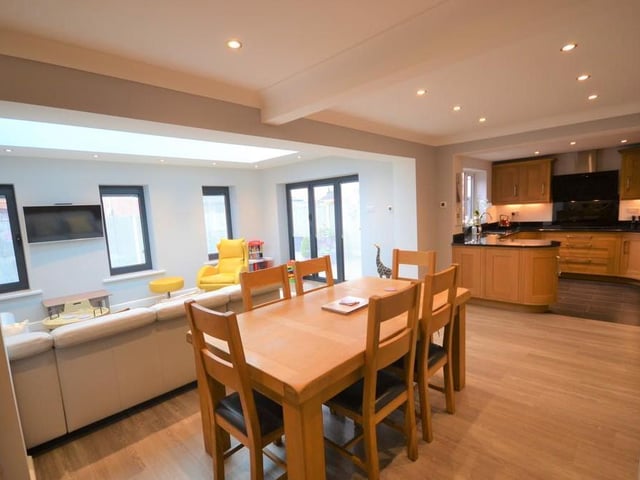 In the dining room side is plenty of space for a table and chairs, inset down lighting and Oak glazed double doors open into the lounge. Karndean luxury vinyl floor tiles.