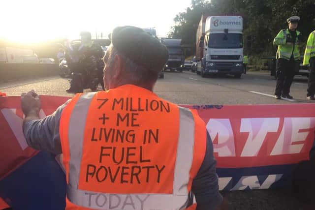Handout photo issued by Insulate Britain of protesters occupying the clockwise and anti-clockwise lanes on the M25 in Surrey this morning. Issue date: Tuesday September 21, 2021.