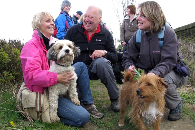 Sheffield Dog Walking Group at Lodge Moor - from left, Victoria Cooper with Honey, Ron Blundell and Helen Chapman with Baxter