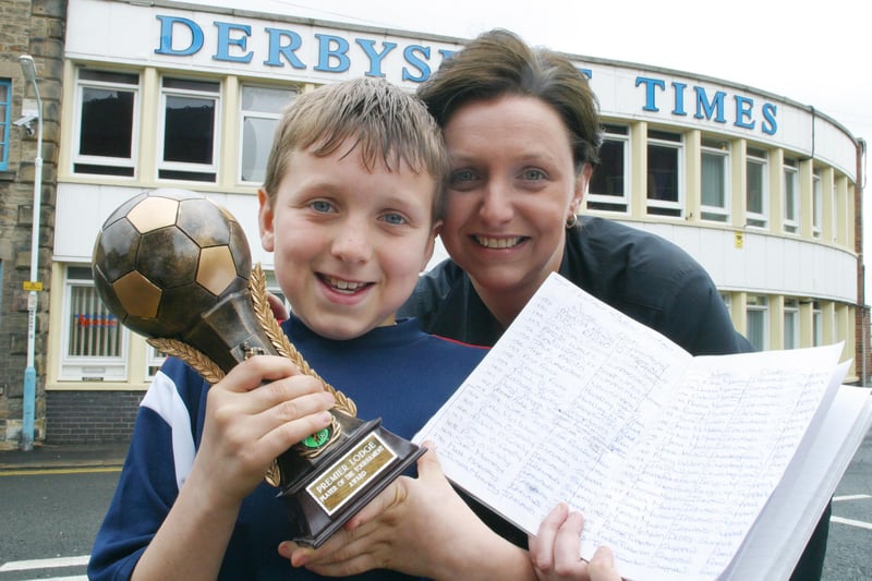Holding the football trophy outside the old Derbyshire Times building